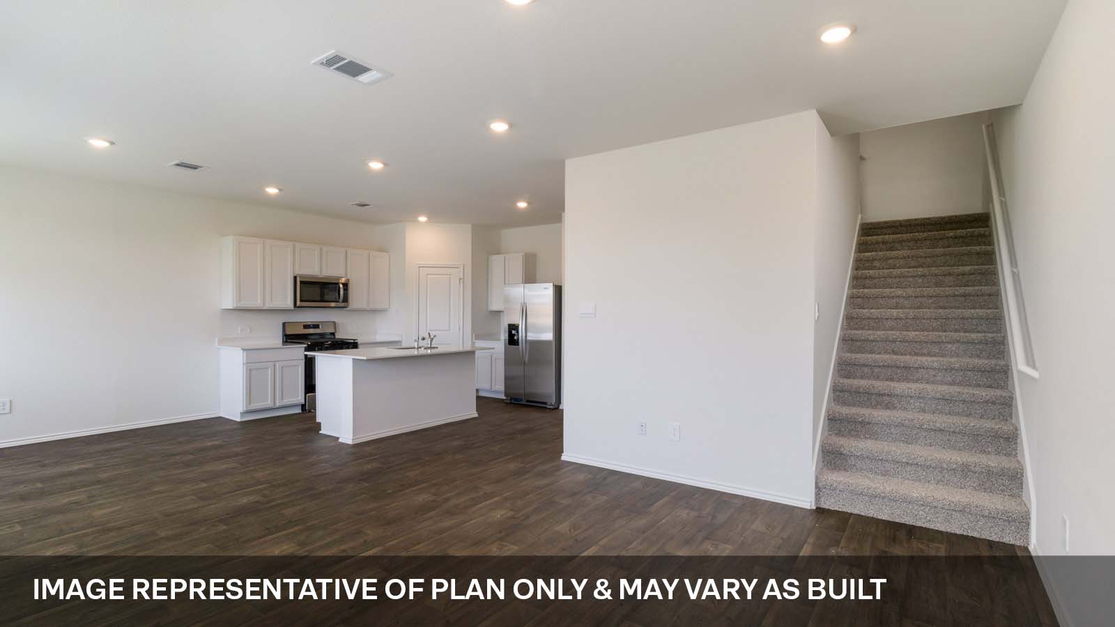1181 Celosia Loop Kyle, TX 78640 - Photo 5 of 17 a view of kitchen with kitchen island white cabinets and stainless steel appliances