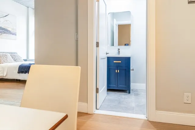 a bathroom with a sink a mirror and a bathtub