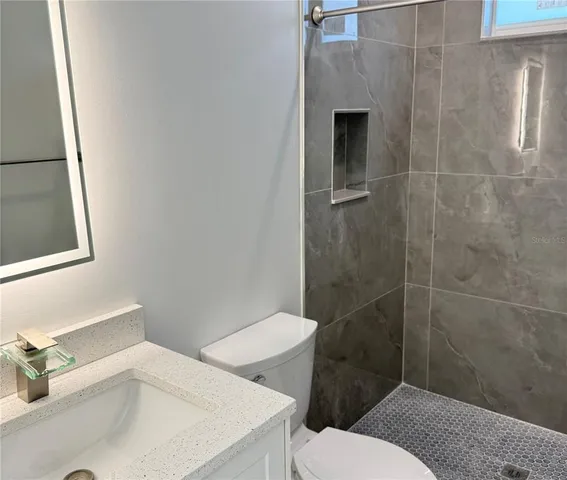 a bathroom with a sink and toilet