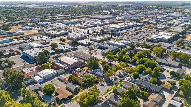 an aerial view of residential houses with city view