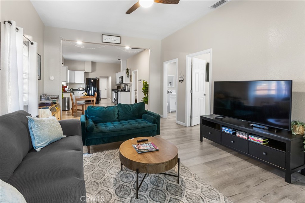 944 West 18th Street Merced, CA 95340 - Photo 5 of 34 a living room with furniture and a flat screen tv