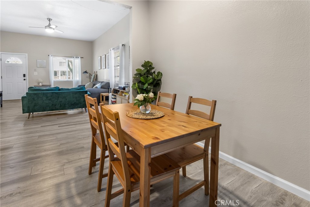 944 West 18th Street Merced, CA 95340 - Photo 9 of 34 a view of a dining room with furniture and wooden floor