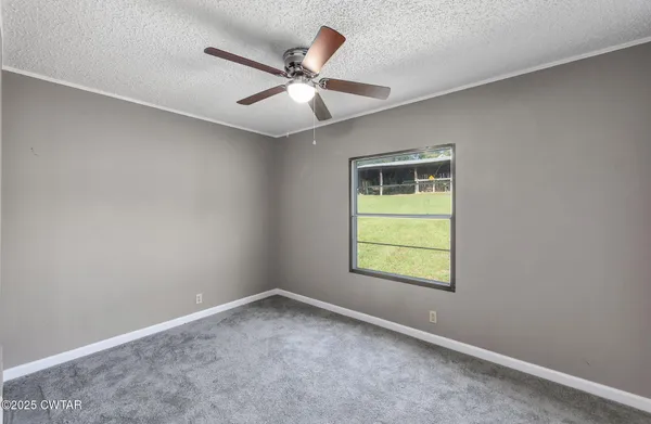 a view of balcony with wooden floor and fence