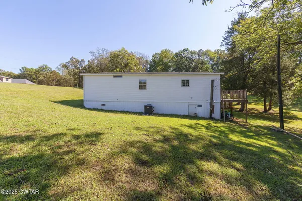 a view of a back yard of the house