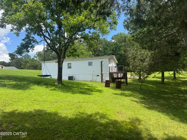 a view of swimming pool with a tree