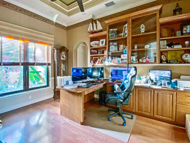 a kitchen with a stove a refrigerator and a table