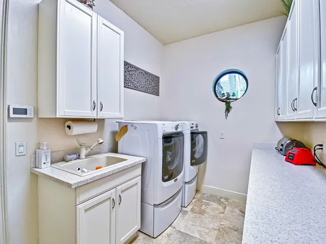 a utility room with dryer and washer