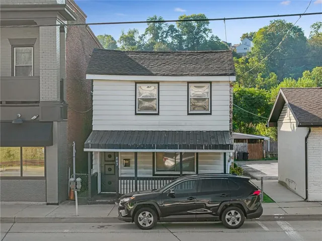 a car parked in front of a house
