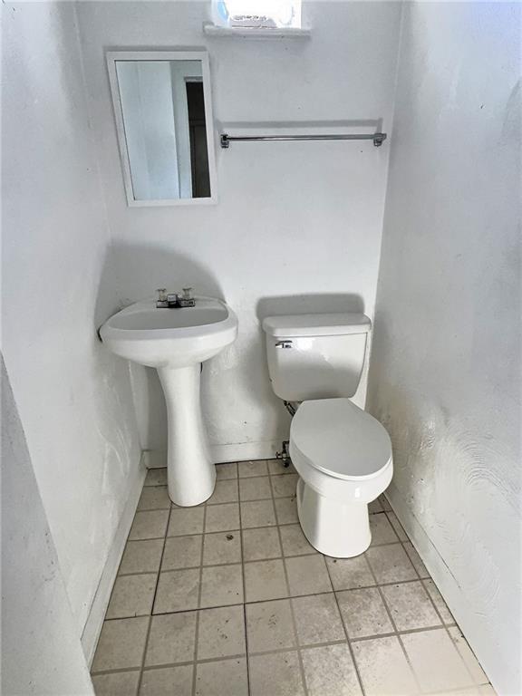 603 West Main Street Carnegie, PA 15106 - Photo 11 of 35 a bathroom with a toilet sink and mirror