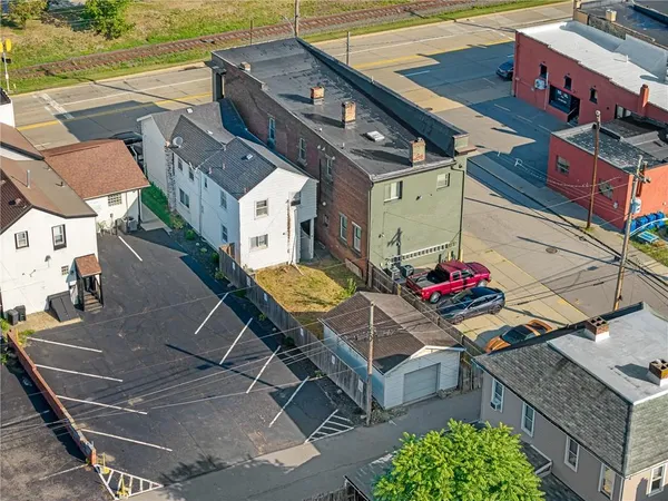 an aerial view of a house with a garden