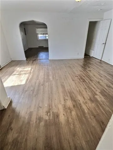 a view of a livingroom with wooden floor