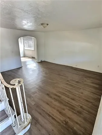 a view of a livingroom with wooden floor