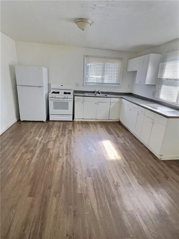 603 West Main Street Carnegie, PA 15106 - Photo 9 of 35 a view of a kitchen with wooden floor and electronic appliances