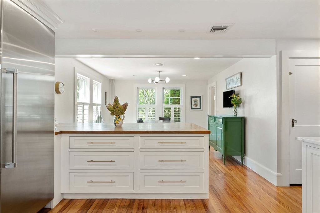 8 Old Salem Road Marblehead, MA 01945 - Photo 11 of 34 a kitchen with granite countertop a refrigerator and a wooden floor
