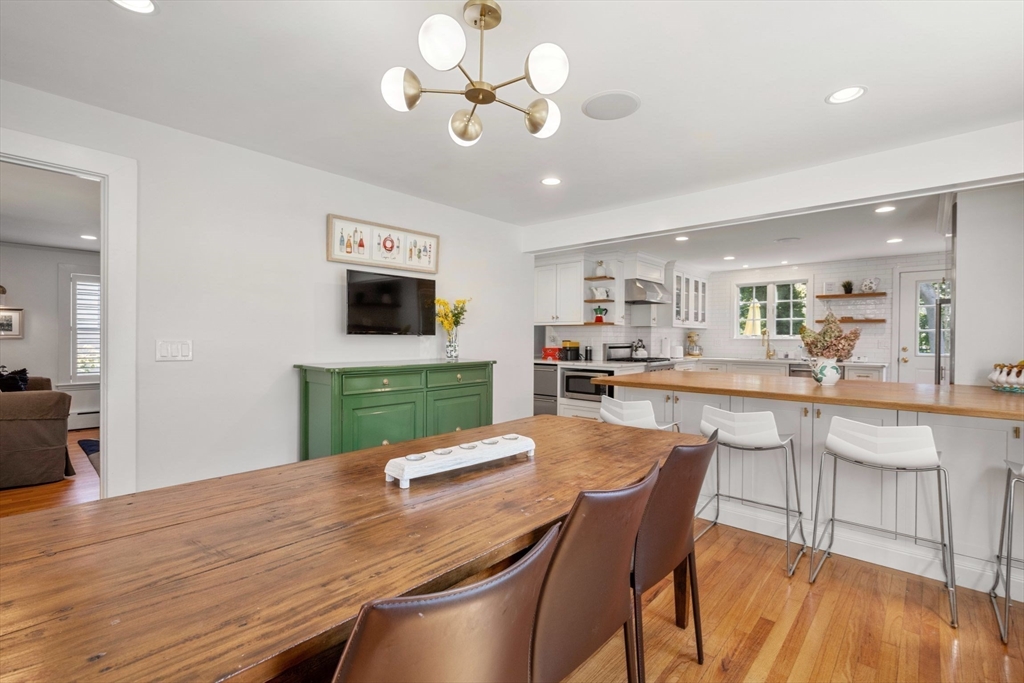 8 Old Salem Road Marblehead, MA 01945 - Photo 4 of 34 a view of a dining room with furniture a kitchen and chandelier