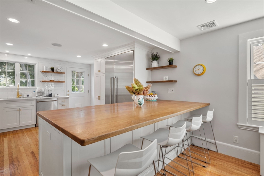8 Old Salem Road Marblehead, MA 01945 - Photo 5 of 34 a kitchen with stainless steel appliances granite countertop a sink a stove top oven a counter space and cabinets