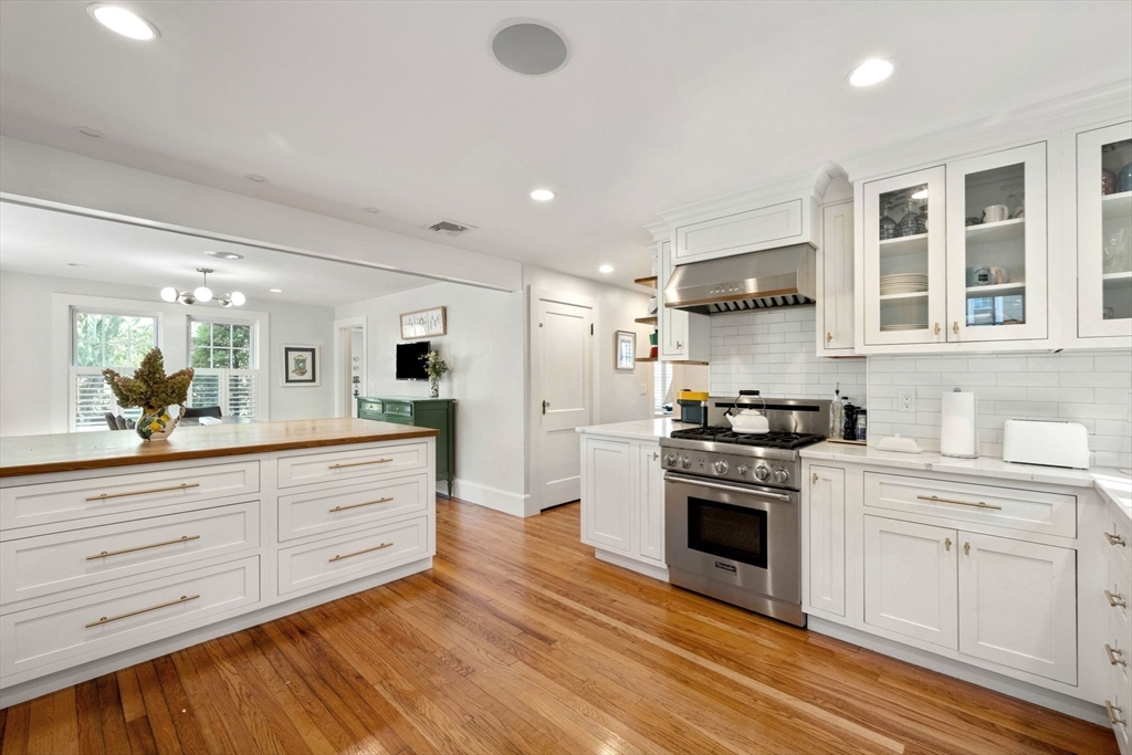 8 Old Salem Road Marblehead, MA 01945 - Photo 10 of 34 a kitchen with stainless steel appliances granite countertop a stove and white cabinets