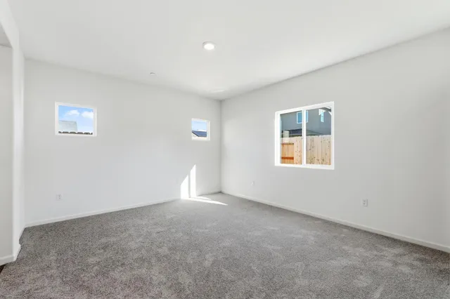 an empty room with a empty space and window