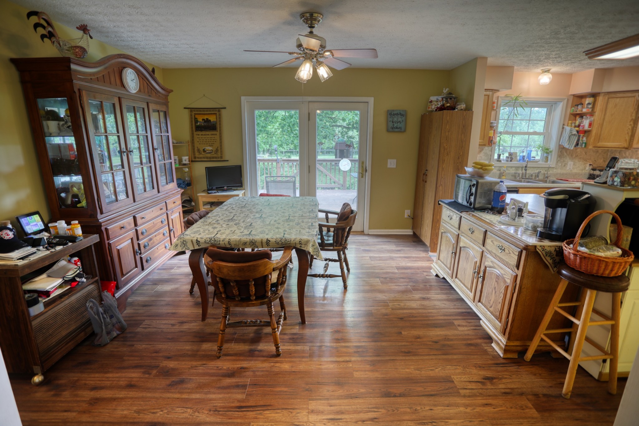 2838 New Roe Road Adolphus, KY 42120 - Photo 16 of 37 a dining room with furniture a chandelier and wooden floor
