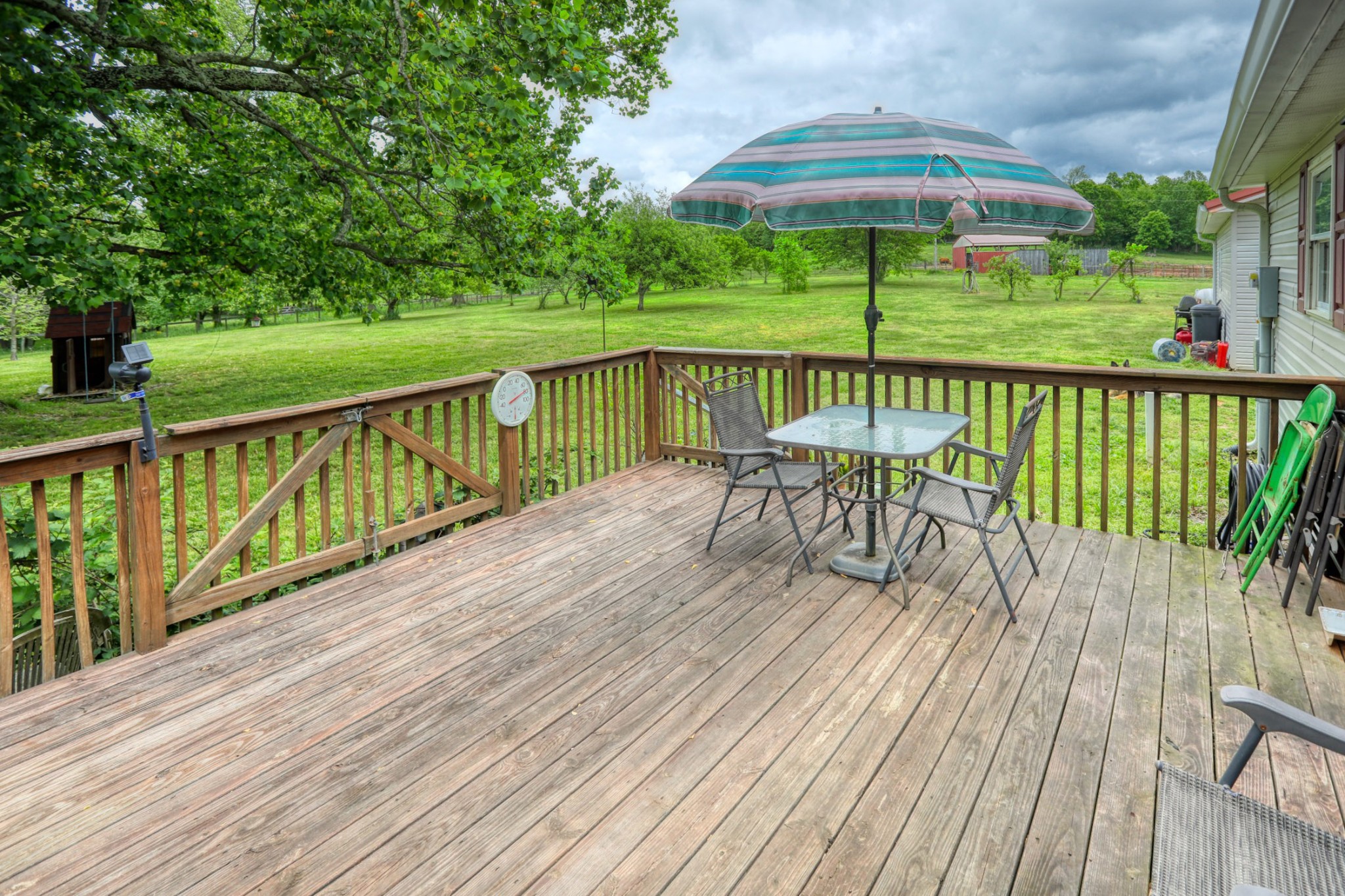 2838 New Roe Road Adolphus, KY 42120 - Photo 20 of 37 a view of balcony with furniture and umbrella