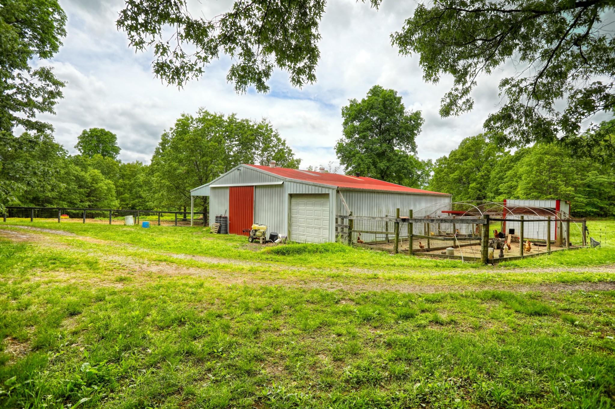 2838 New Roe Road Adolphus, KY 42120 - Photo 26 of 37 a backyard of a house with table and chairs