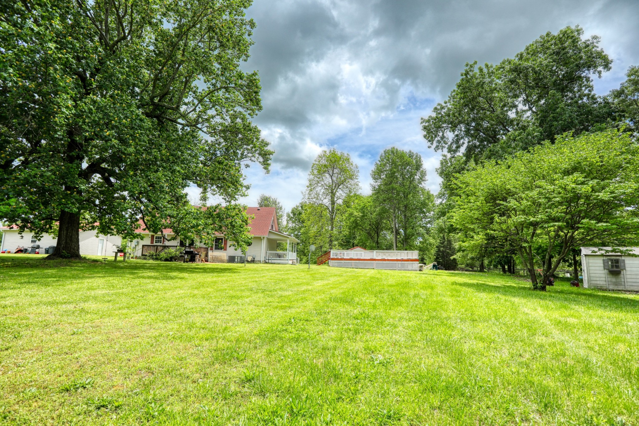 2838 New Roe Road Adolphus, KY 42120 - Photo 30 of 37 a view of a big yard with a house in the background