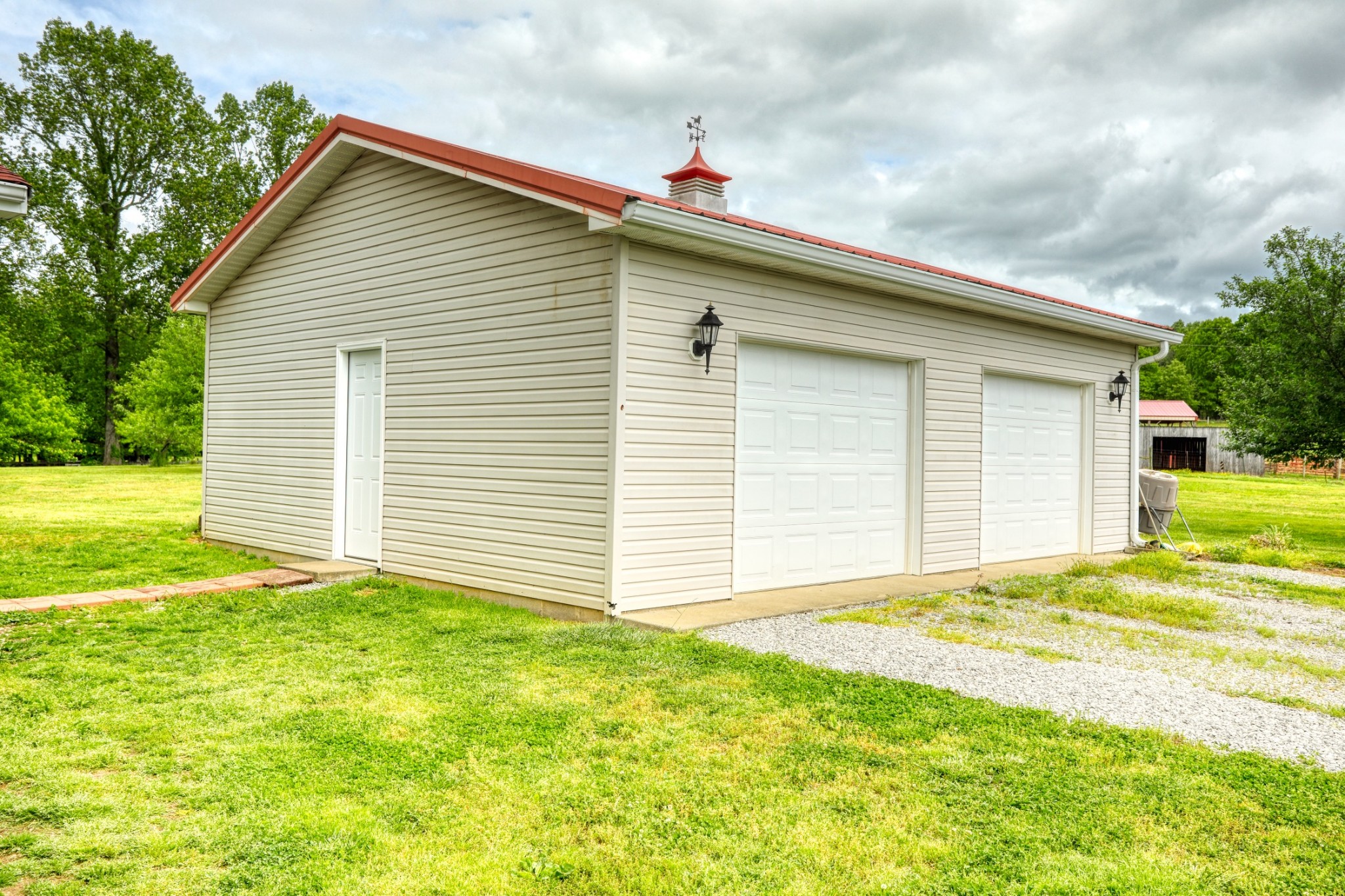 2838 New Roe Road Adolphus, KY 42120 - Photo 33 of 37 a view of a house with a yard and garage