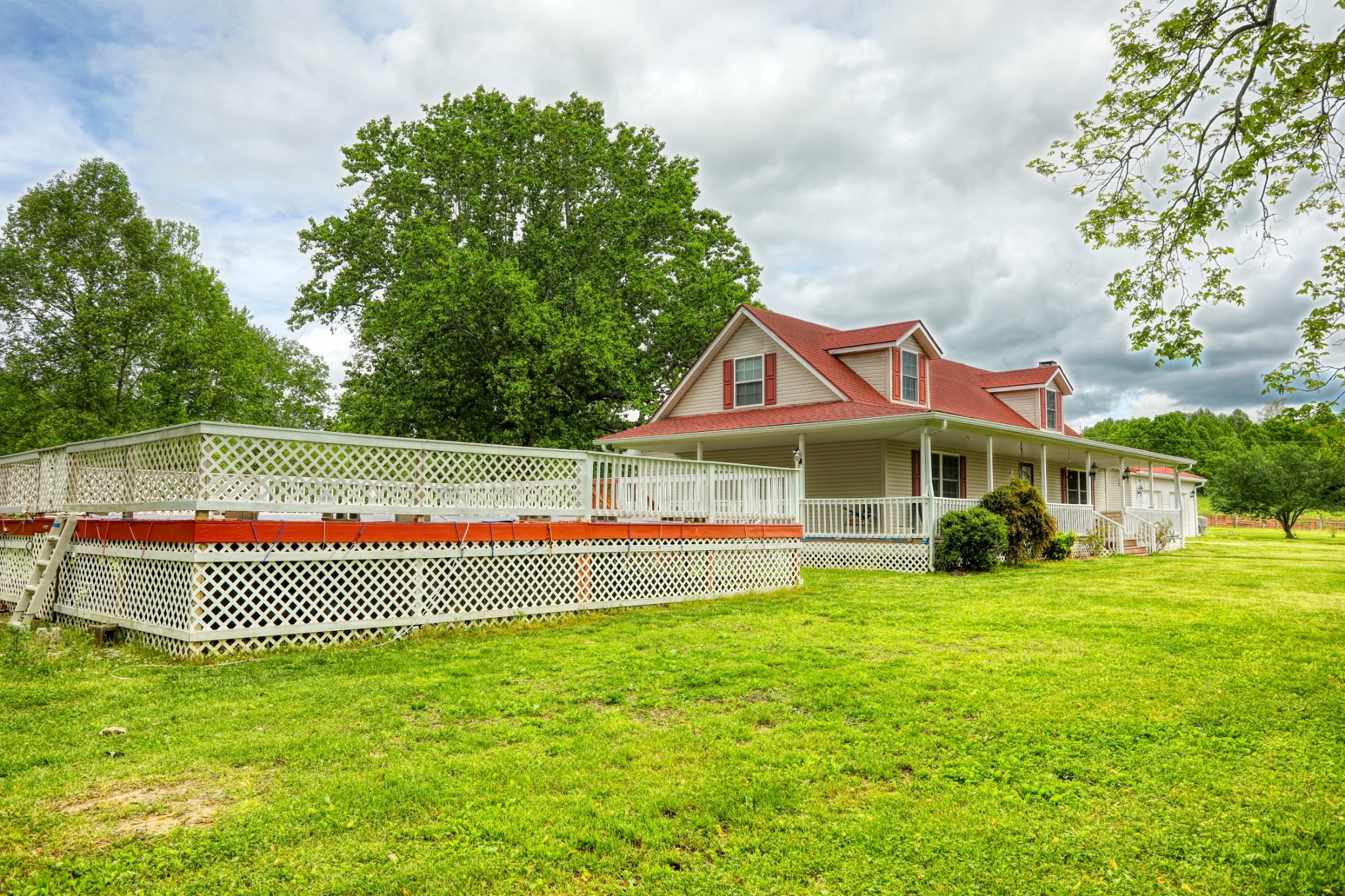 2838 New Roe Road Adolphus, KY 42120 - Photo 34 of 37 a view of a house with a yard and sitting area