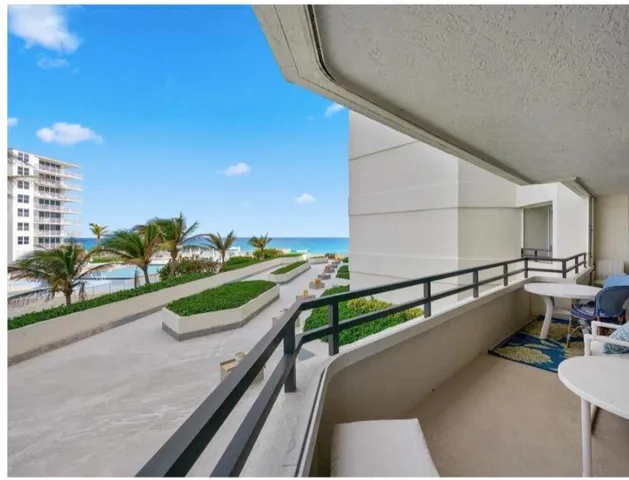 a view of balcony with outdoor seating