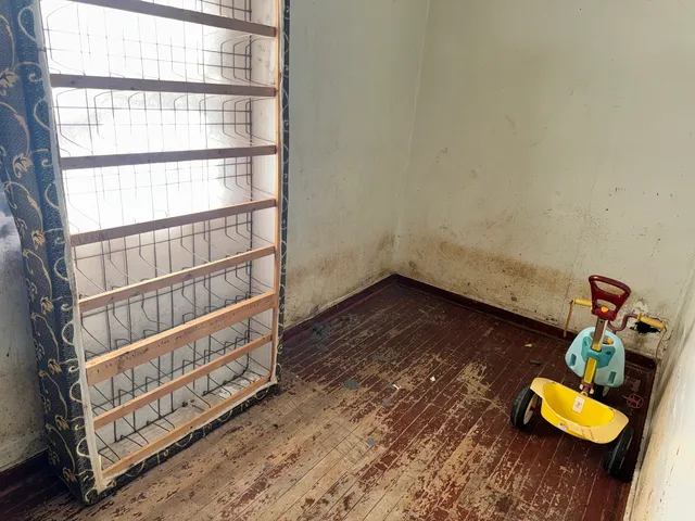 a view of staircase with wooden floor