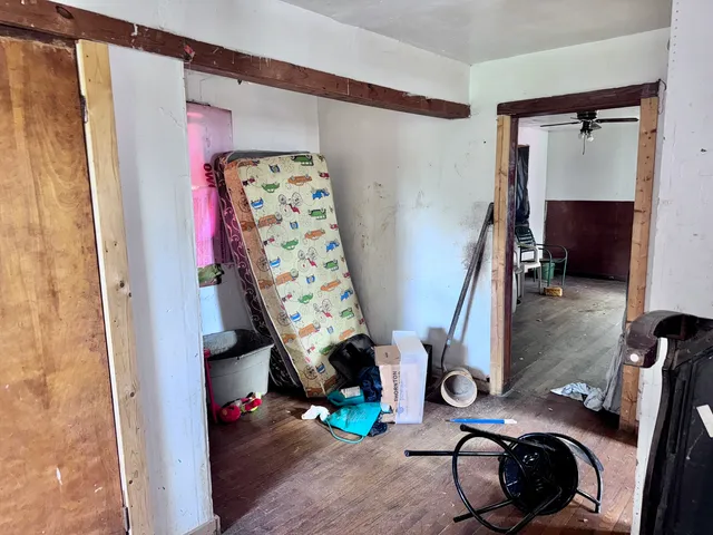 a view of gym equipment with clothes and shoes