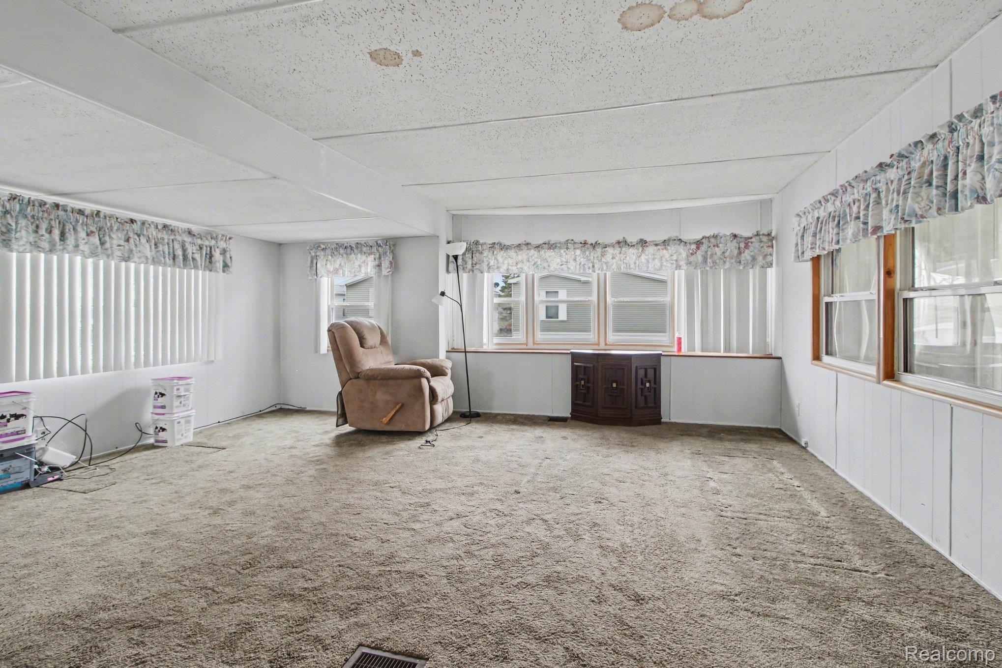 39500 Warren Road, Unit 87 Canton, MI 48187 - Photo 2 of 11 Sitting room featuring carpet floors