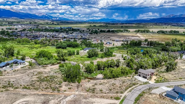 a view of a yard with an outdoor seating