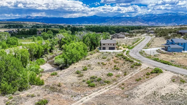 a view of a houses with a yard and lake view