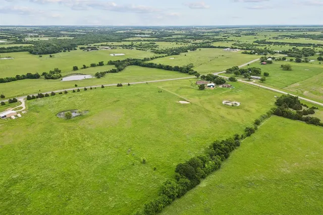 a view of an ocean and a yard
