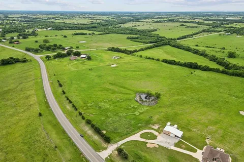 a view of a golf course with a ocean view