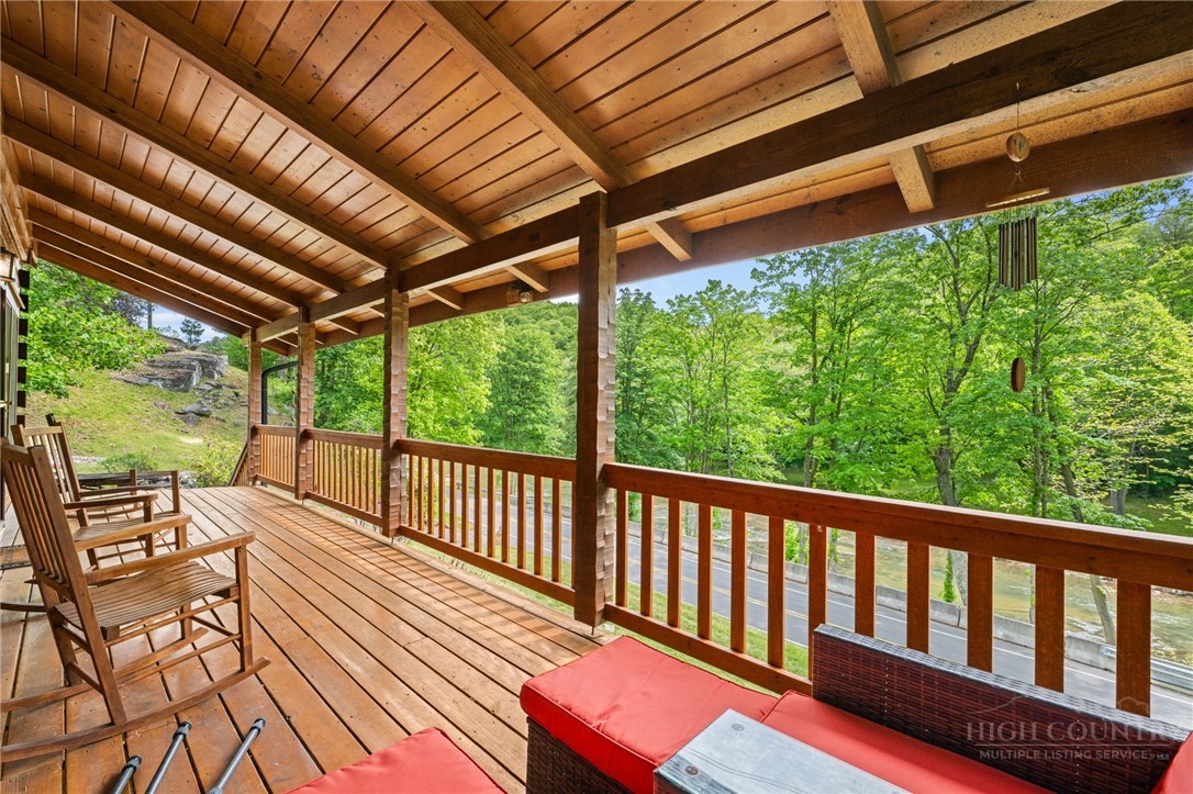 613 Silas Creek Road Lansing, NC 28643 - Photo 9 of 40 a view of a chairs and table in the balcony