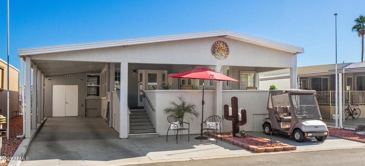 17200 West Bell Road, Unit 390 Surprise, AZ 85374 - Photo 1 of 40 a view of a patio with table and chairs