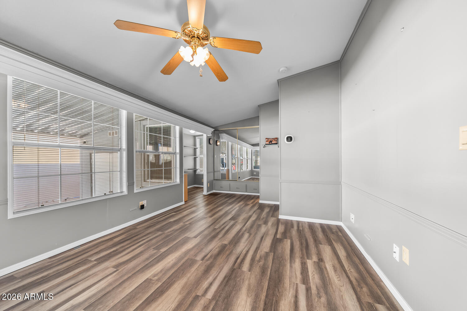 17200 West Bell Road, Unit 390 Surprise, AZ 85374 - Photo 12 of 40 wooden floor in an empty room with a window