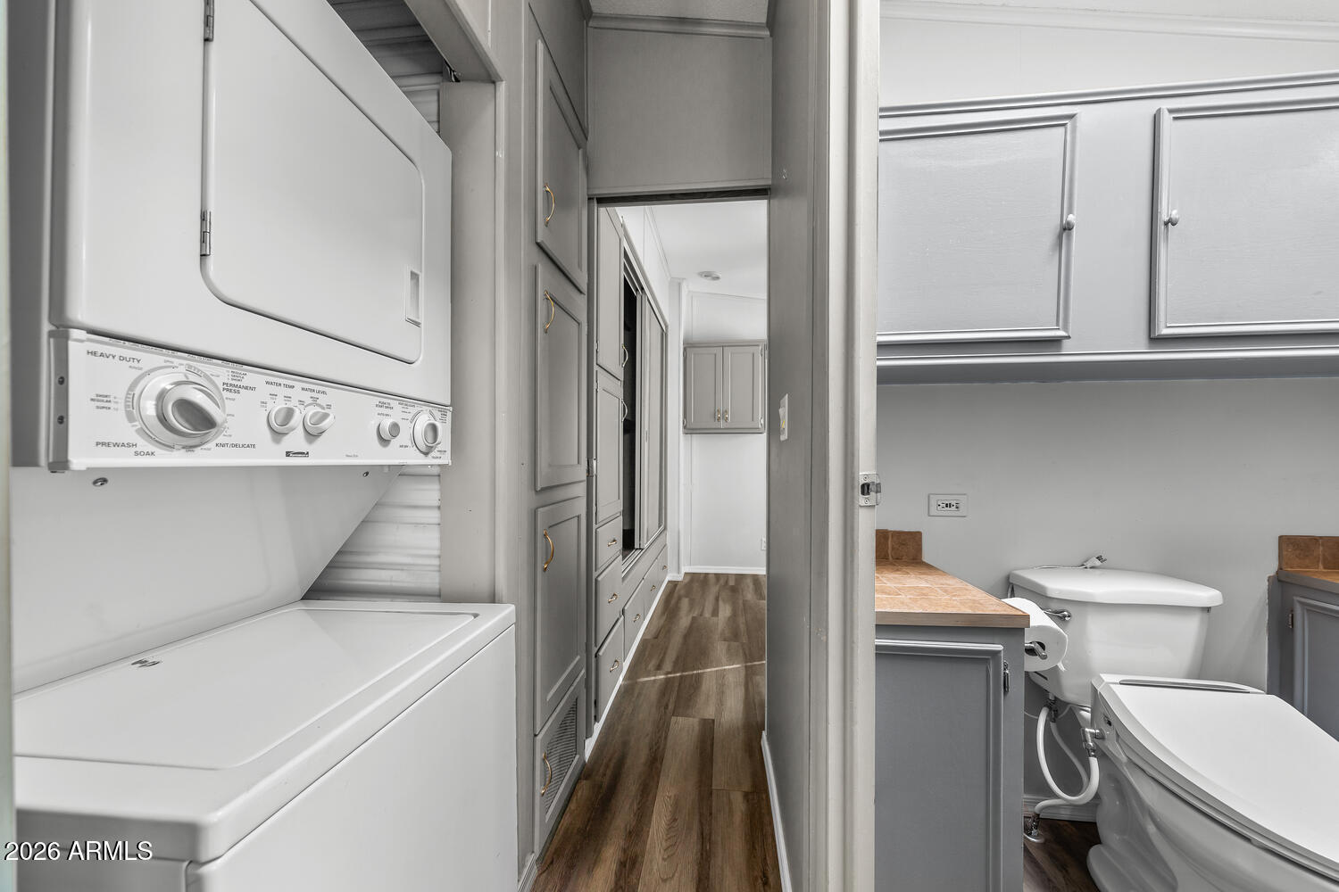 17200 West Bell Road, Unit 390 Surprise, AZ 85374 - Photo 23 of 40 a bathroom with a toilet sink and mirror