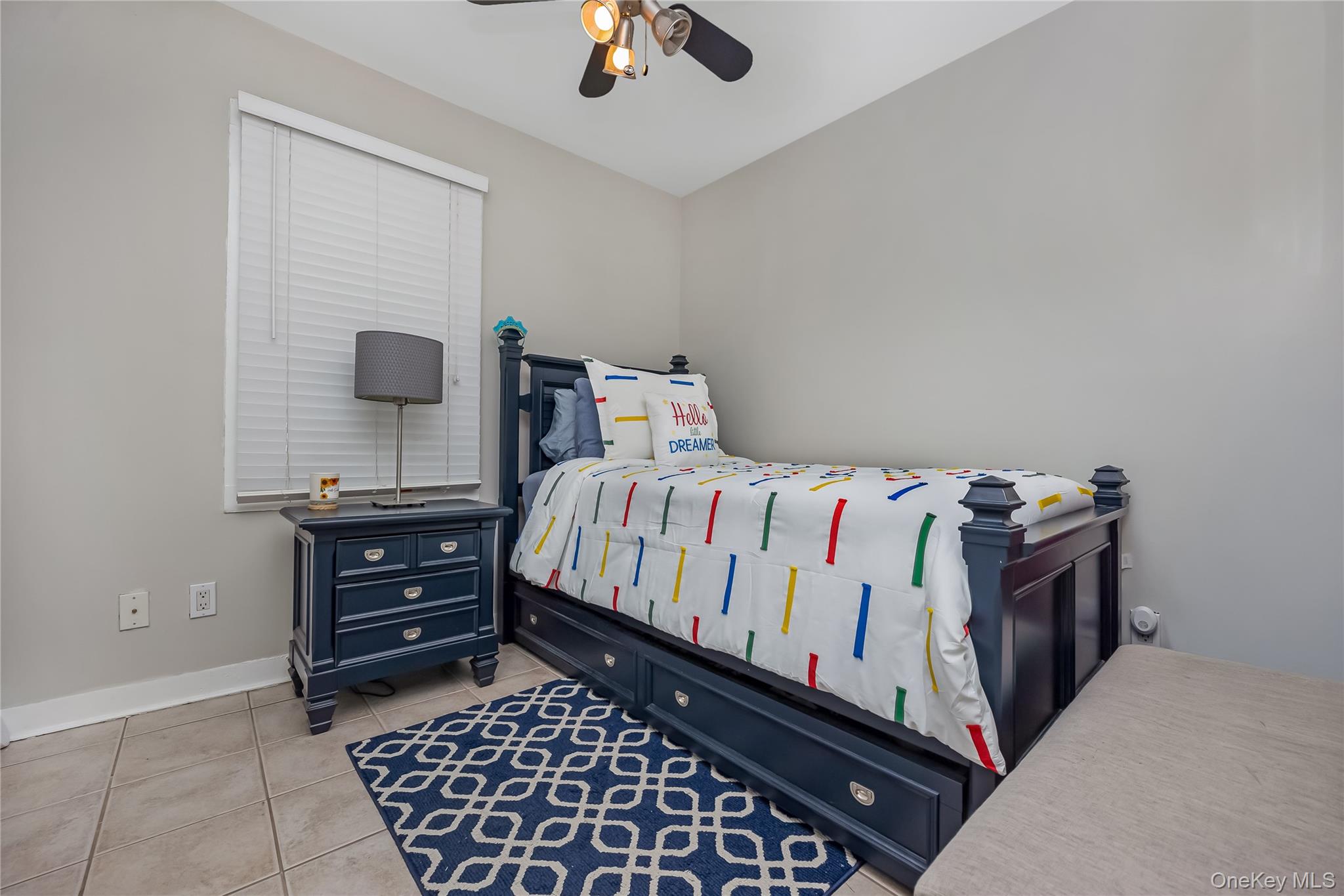 27 June Walk Long Beach, NY 11561 - Photo 13 of 20 a bedroom with a bed and a chandelier