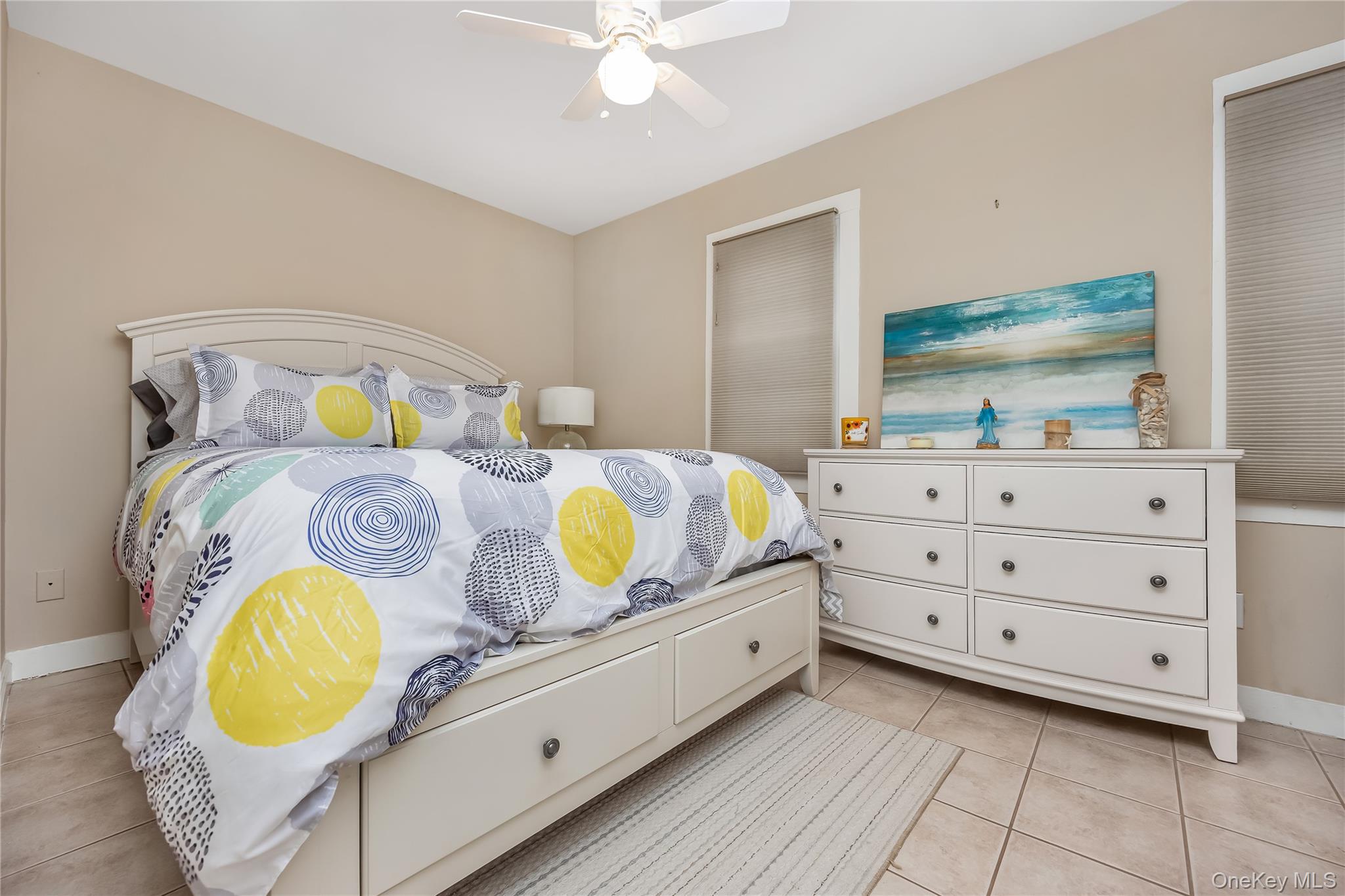 27 June Walk Long Beach, NY 11561 - Photo 14 of 20 a bed room with a bed and a mirror