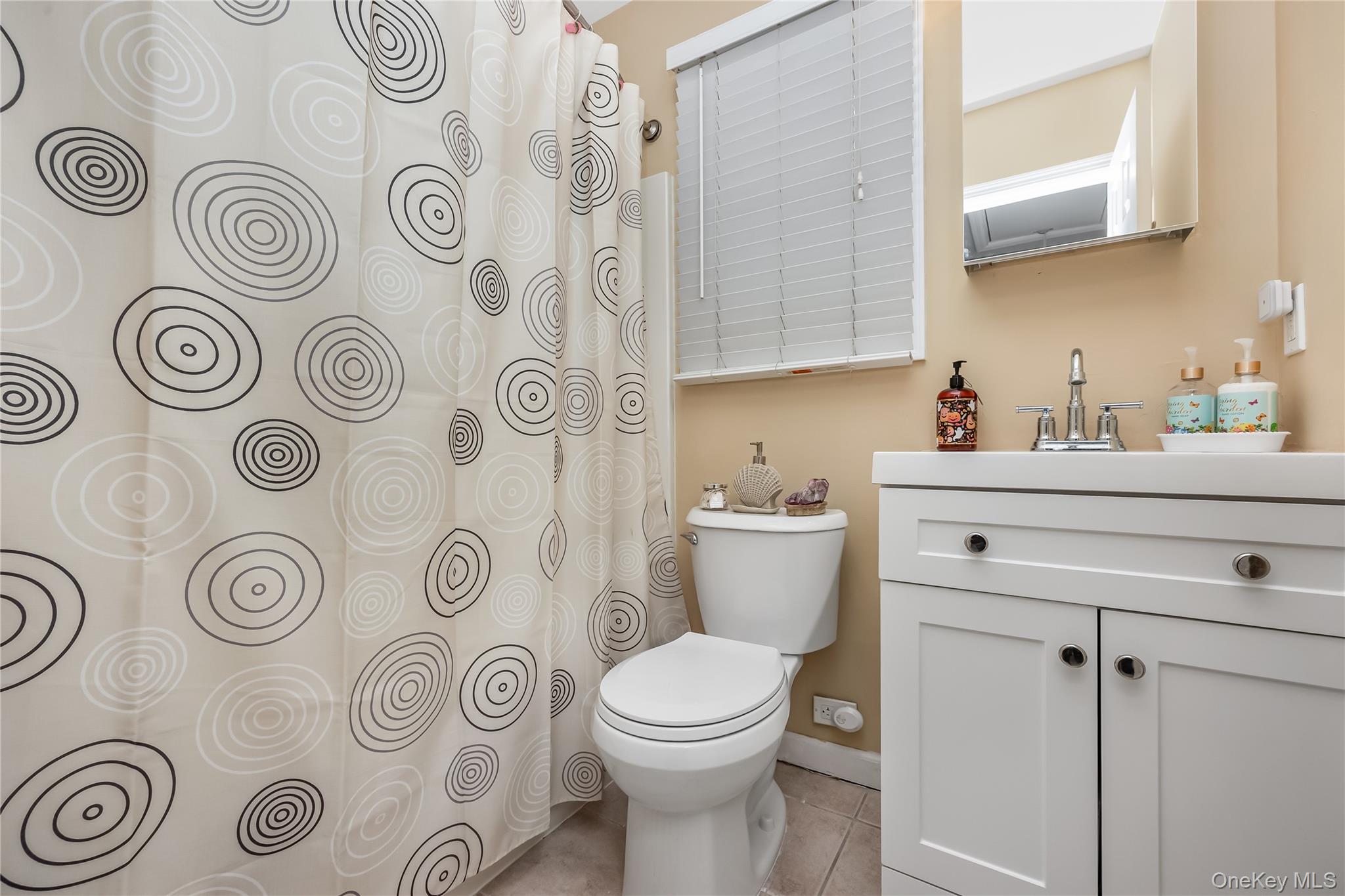27 June Walk Long Beach, NY 11561 - Photo 16 of 20 a bathroom with a toilet sink and mirror