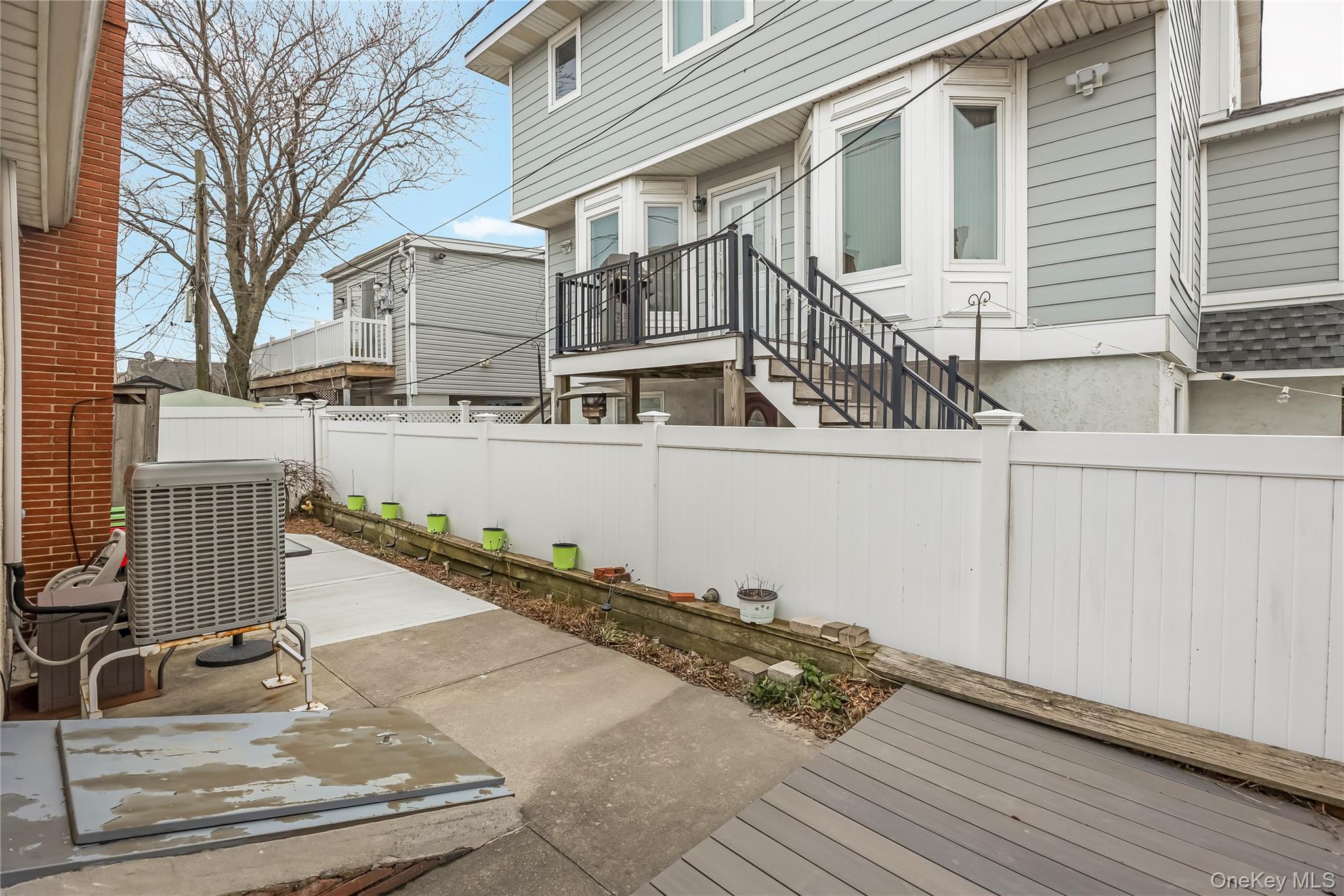 27 June Walk Long Beach, NY 11561 - Photo 18 of 20 a view of a house with wooden fence