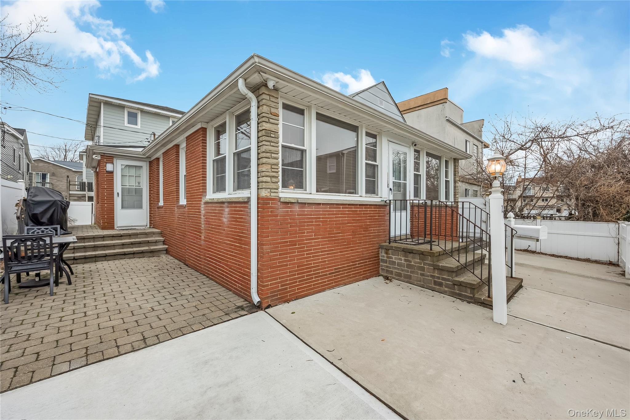 27 June Walk Long Beach, NY 11561 - Photo 5 of 20 a front view of a house with a garage