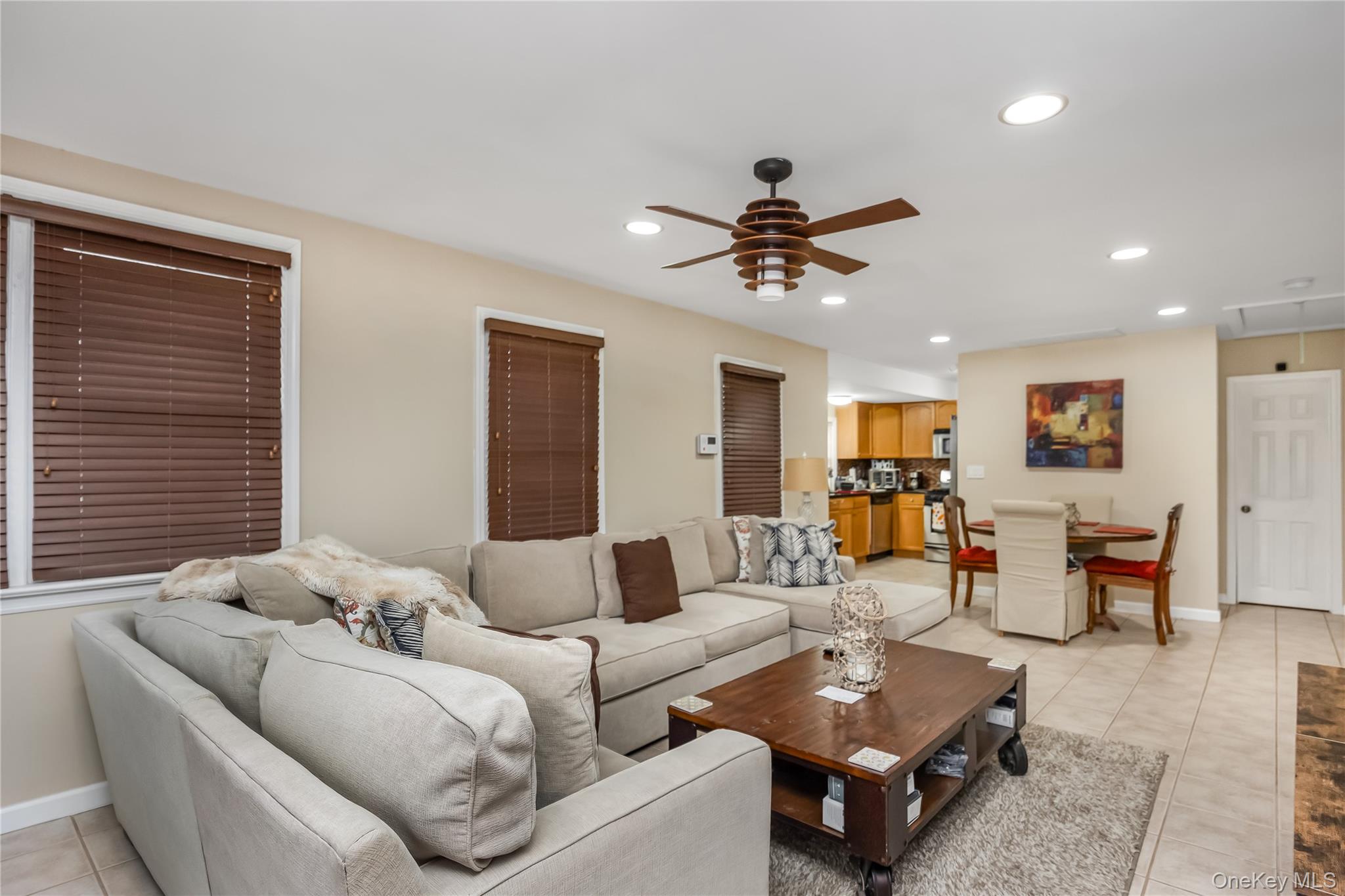 27 June Walk Long Beach, NY 11561 - Photo 8 of 20 a living room with furniture a ceiling fan and a window