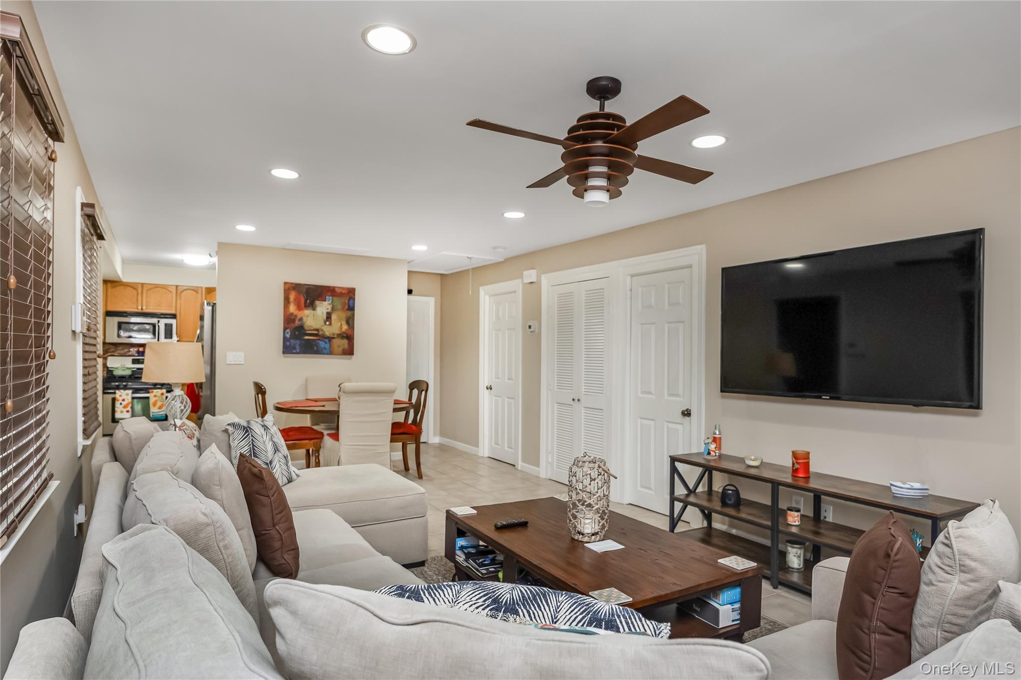 27 June Walk Long Beach, NY 11561 - Photo 9 of 20 a living room with furniture and a flat screen tv