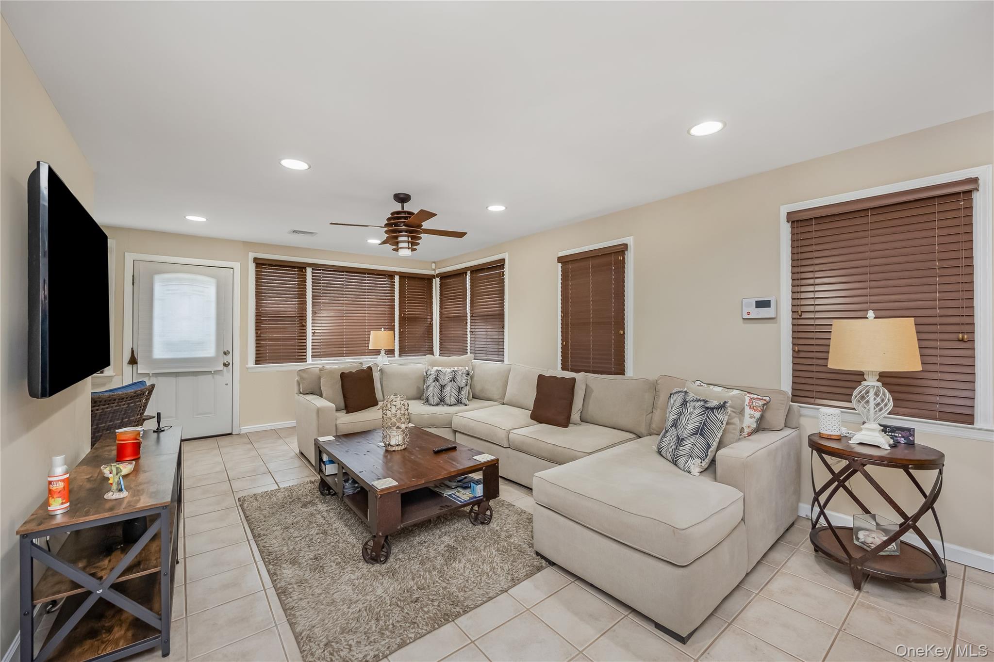 27 June Walk Long Beach, NY 11561 - Photo 10 of 20 a living room with furniture and a flat screen tv