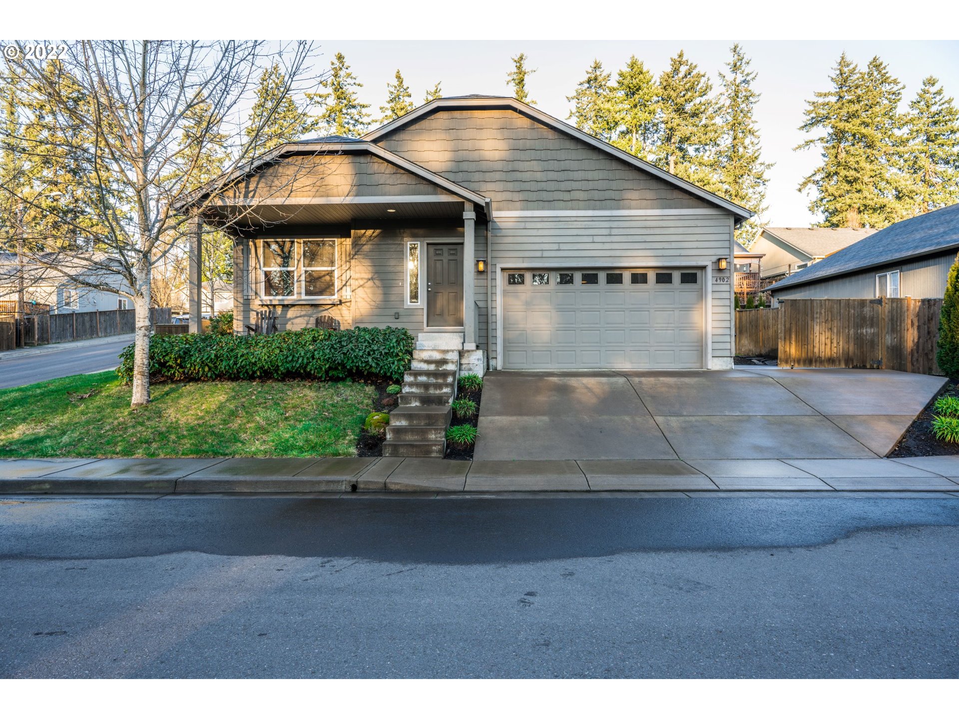4902 Holly Street Springfield, OR 97478 - Photo 1 of 16 a front view of a house with a yard and garage