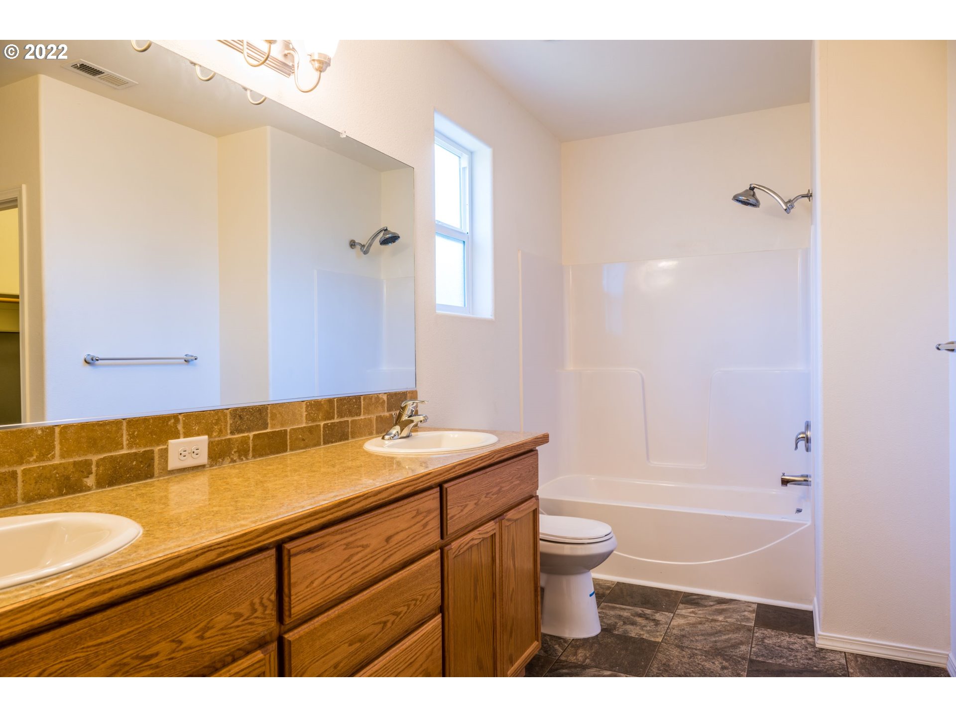 4902 Holly Street Springfield, OR 97478 - Photo 10 of 16 a bathroom with a granite countertop sink toilet and shower